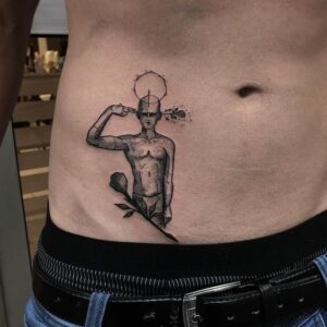 tatuagem masculina na virilha de rosas