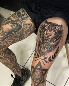 tatuagem de tigre na coxa masculina